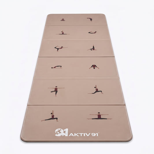 A beige yoga mat with printed exercise pose illustrations and the brand name 'AKTIV 91' at the bottom, shown on a clean white background.